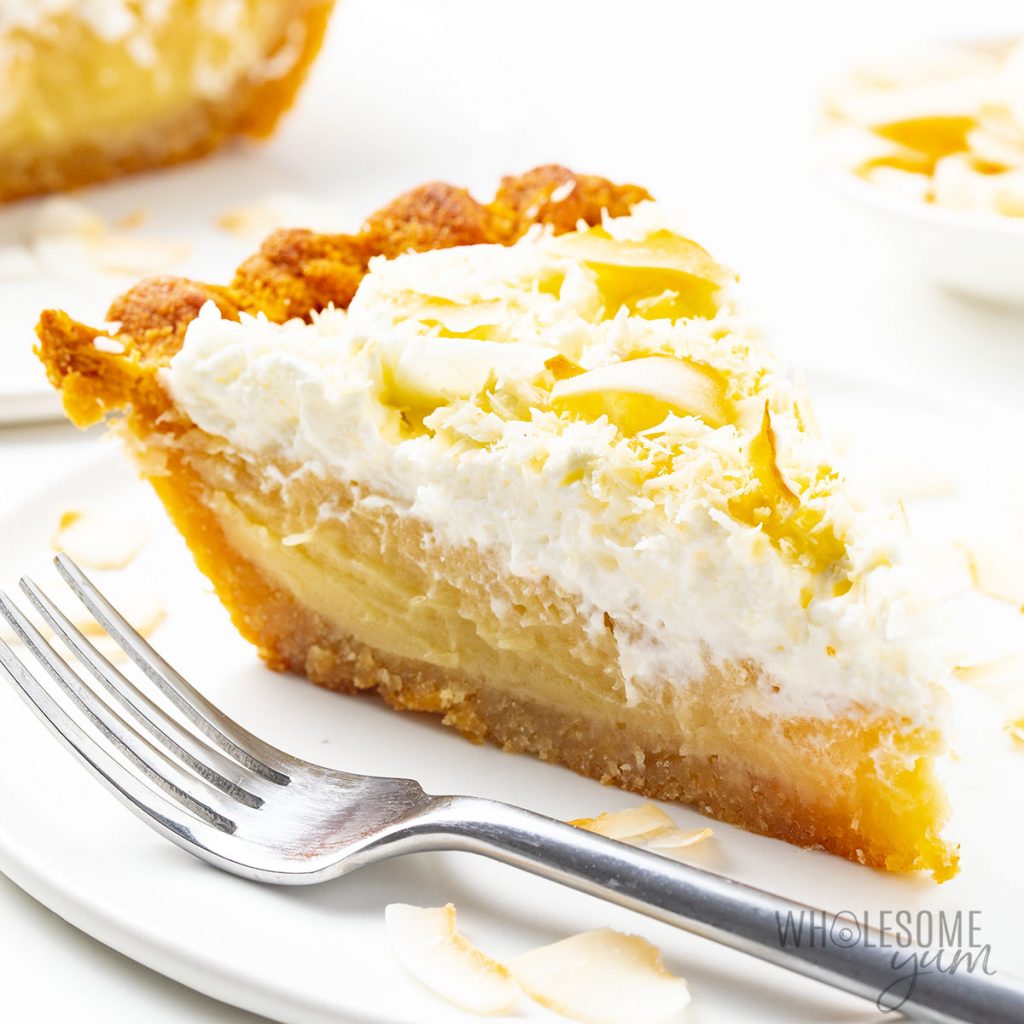 Coconut Cream Pie – Wholesome Yum Coconut cream pie on a plate.